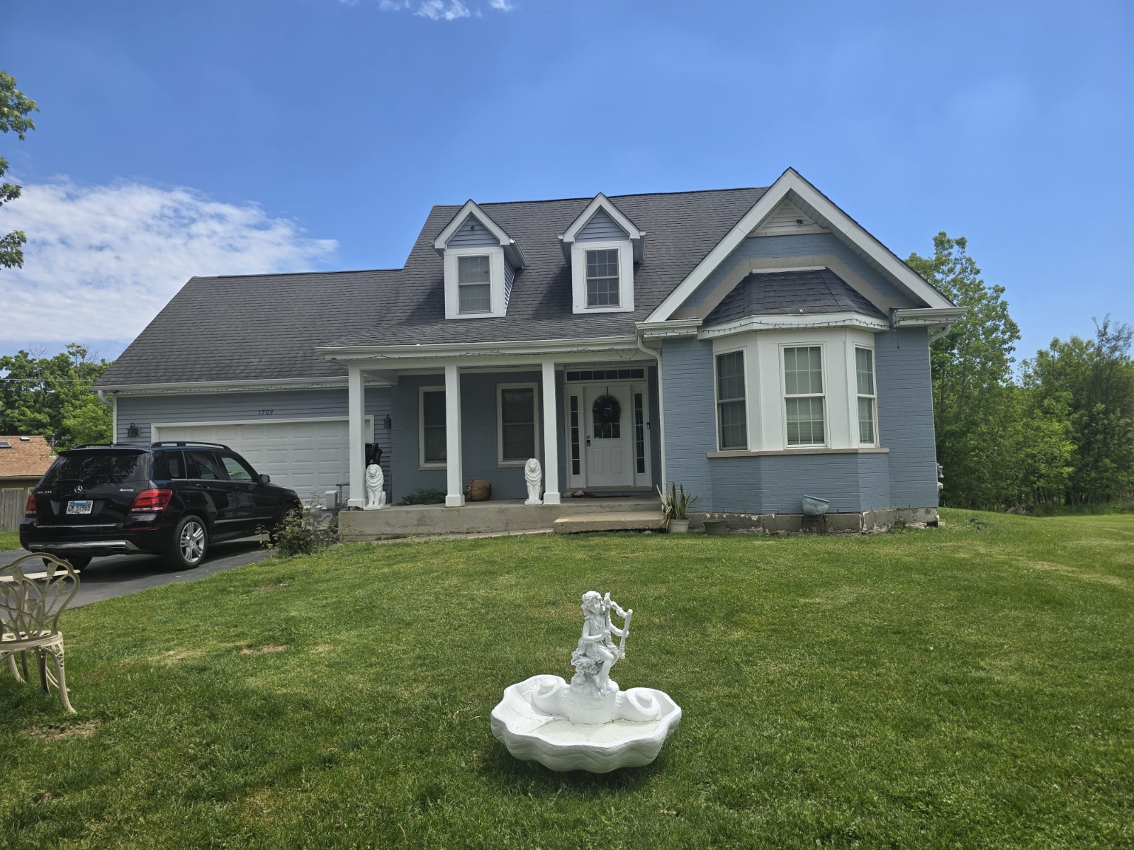 Finished blue house exterior remodeling project